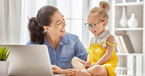 Mom and daughter with a laptop looking for Legitimate stay at home mom jobs