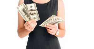 a woman holding free money in her hands