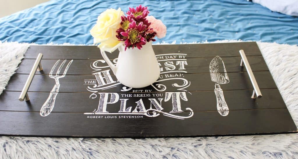 A black decorated serving tray