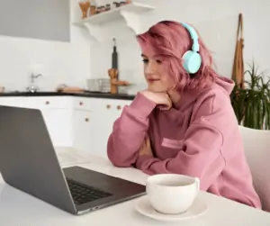 girl on laptop wanting to get paid to watch videos