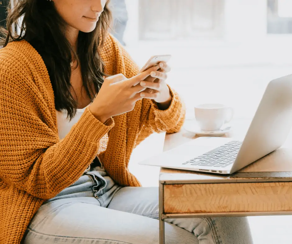 woman signing up on phone for free money