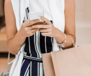 woman on phone looking to sign up and get money instantly.